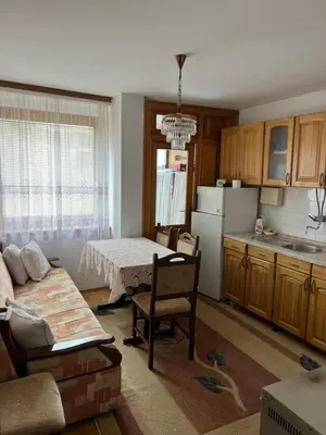 a kitchen with a couch and a table in a room at Royal Travnik in Travnik