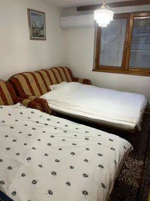 a bedroom with two beds and a window at Royal Travnik in Travnik