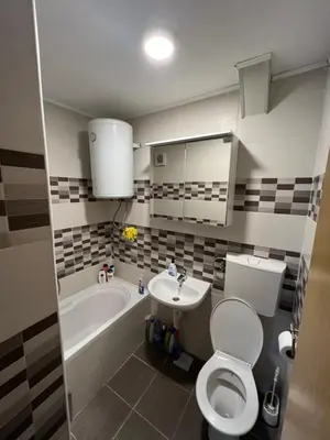 a bathroom with a toilet and a sink and a tub at Royal Travnik in Travnik