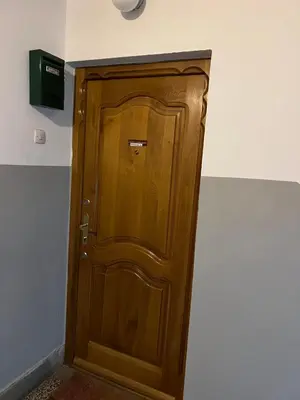 a wooden door in the corner of a room at Royal Travnik in Travnik