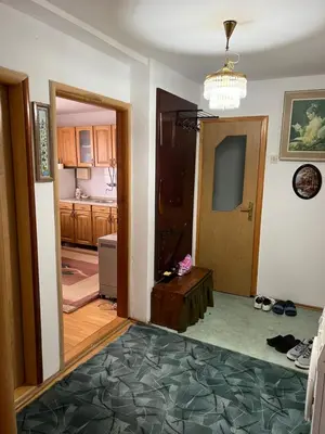 a living room with a door open to a kitchen at Royal Travnik in Travnik