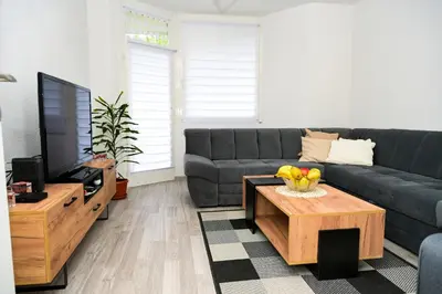 a living room with a couch and a coffee table at Apartman Castello in Jajce