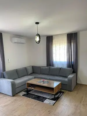 a living room with a couch and a coffee table at Apartman David in Jajce