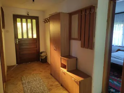 a room with a closet and a door and a bedroom at Apartman Džanan in Jajce
