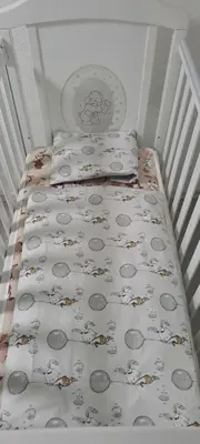 a small bed with two pillows and a blanket on it at Apartman Aydan in Jajce