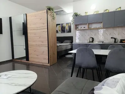 a kitchen with a table and chairs in a room at Relax 2 in Bosanska Dubica