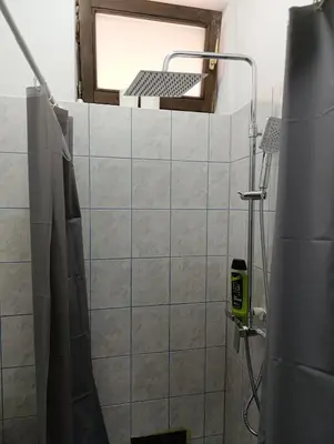 a bathroom with a shower with a mirror at Relax 2 in Bosanska Dubica