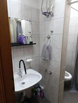 a bathroom with a sink and a shower at Relax 2 in Bosanska Dubica