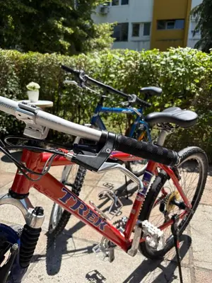 two bikes parked next to each other on a sidewalk at SM studio apartman in Banja Luka