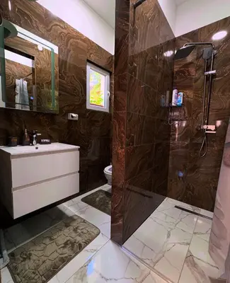 a bathroom with a shower and a sink at SM studio apartman in Banja Luka