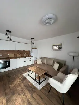 a living room with a couch and a table at Apartman Palazzo in Bosanska Krupa