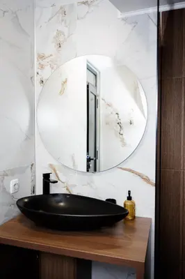 a bathroom with a black sink and a mirror at Apartman 101 in Visoko