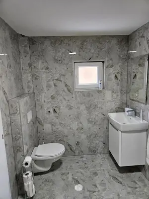 a bathroom with a toilet and a sink at Jelena in Jajce