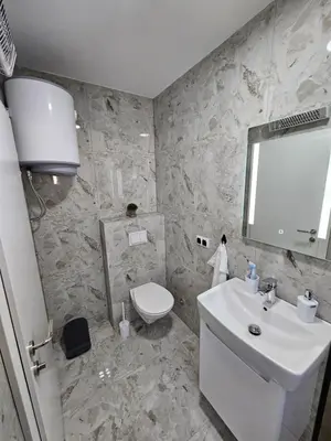a bathroom with a white sink and a toilet at Jelena in Jajce