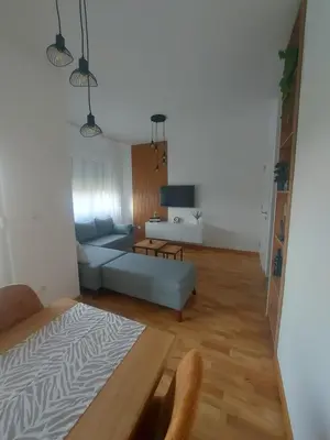 a living room with a bed and a couch at Apartman Nina Residence Banja Luka in Banja Luka