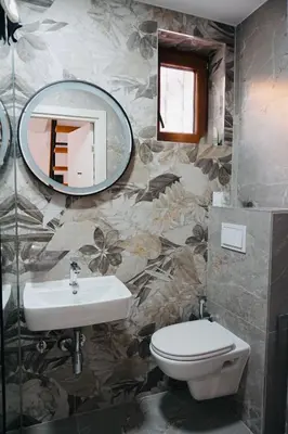 a bathroom with a sink and a mirror at HANA Superior Apartment in Kakanj