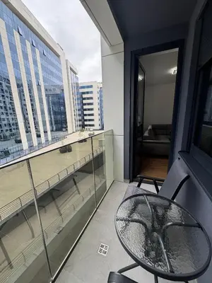 a balcony with a table and a view of a city at Divna Besplatan parking in Banja Luka