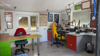 an office with two desks and two chairs in a room at Haus Viktoria near Banja Luka in Banja Luka