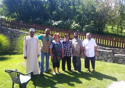 a group of people posing for a picture in a yard at Haus Viktoria near Banja Luka in Banja Luka