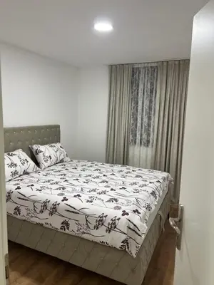 a bedroom with a bed and a window at Stan na dan Ana in Prozor