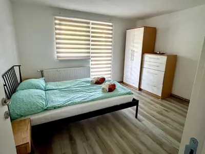 a bedroom with a bed with two teddy bears on it at Apartmani Fazinasa