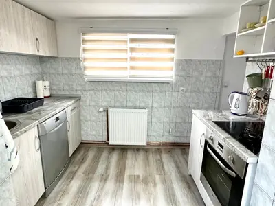 a kitchen with a sink and a stove top oven at Apartmani Fazinasa