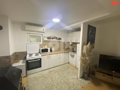 a kitchen with white cabinets and a stove at Vikendica Sarah in Tuzla