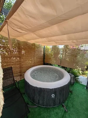 a large hot tub under a large umbrella at Horizont Bihać in Bihać