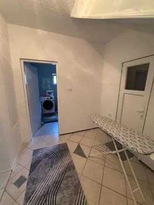 a room with a door and a bench in it at Horizont Bihać in Bihać