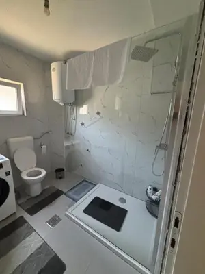 a bathroom with a shower and a toilet at Horizont Bihać in Bihać