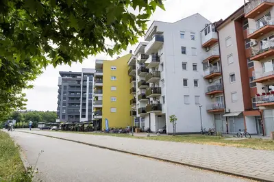 an empty street in front of apartment buildings at Polza in Banja Luka