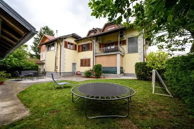 a ping pong table in the yard of a house at Apartman HAAN in Bihać