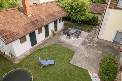 an aerial view of a backyard with a blue chair at Apartman HAAN in Bihać