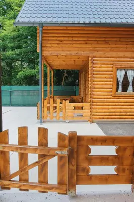 a wooden cabin with a fence in front of it at Hafizove ville na Uni in Illidža