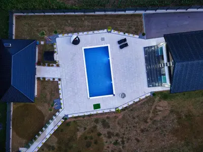 an overhead view of a house with a swimming pool at Villa La Casa Del Sol in Srebrenik