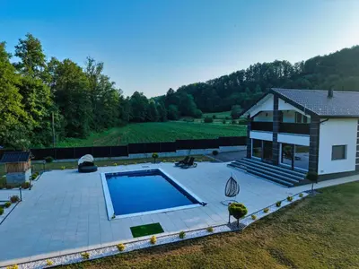 an overhead view of a swimming pool in a backyard at Villa La Casa Del Sol in Srebrenik