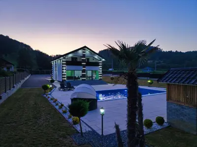 a small house with a swimming pool in a yard at Villa La Casa Del Sol in Srebrenik