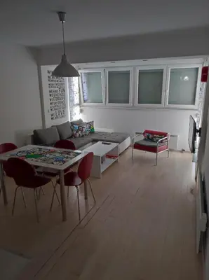 a living room with a couch and a table at Apartman Doma in Livno