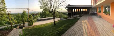 a walkway next to a building with a pavilion at House Crkvina