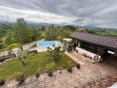 an aerial view of a house with a swimming pool at House Crkvina