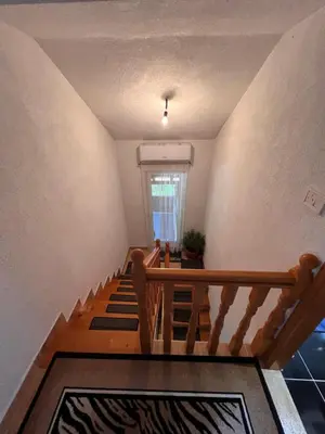 a staircase in a house with a stair case at House Crkvina