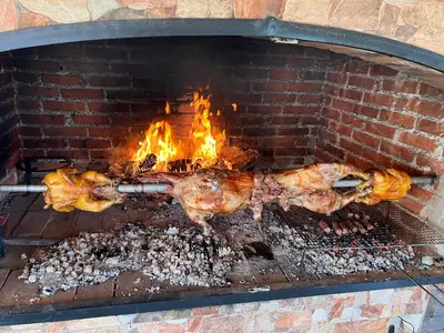 a brick oven with food cooking in it at House Crkvina