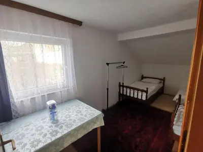 a small room with a bed and a window at House Crkvina