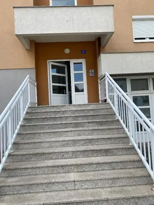 a set of stairs leading to a door of a building at Apartment Boky in Livno