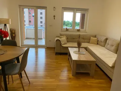 a living room with a couch and a table at Apartment Boky in Livno