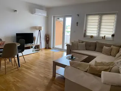 a living room with a couch and a table at Apartment Boky in Livno