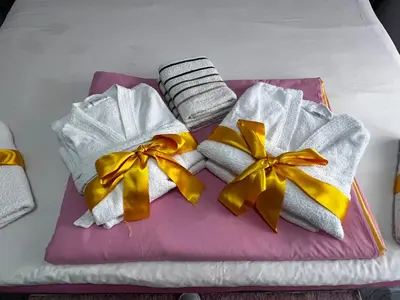 a group of towels with bows on a table at Apartmani M&DŽ Bihać in Bihać