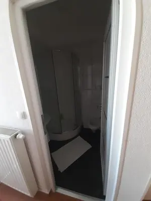 a bathroom with a shower and a toilet at Motel Plaza in Bihać