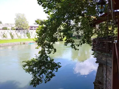 a river with a reflection of the sky in the water at Hotel Vila Vrbas in Banja Luka