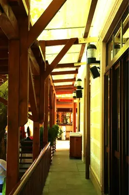 an empty hallway of a building with a wooden ceiling at Hotel Vila Vrbas in Banja Luka
